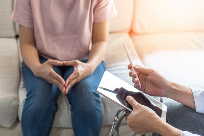 Doctor explaining information to female patient