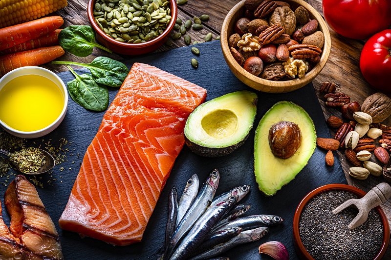 Table of food of the Mediterranean diet - salmon, nuts, avocado