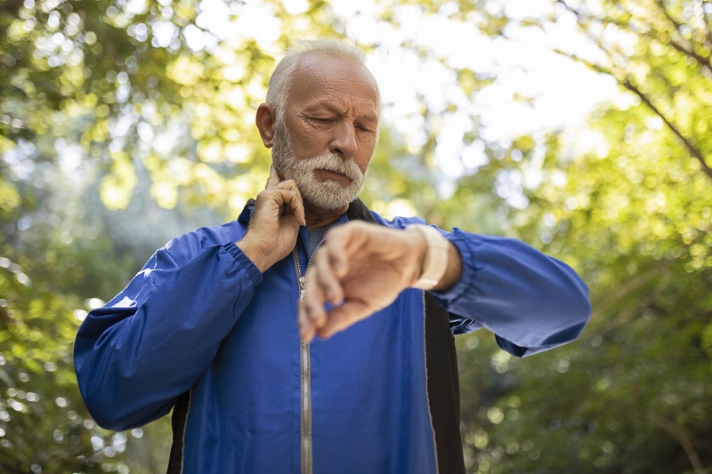 Man checking pulse