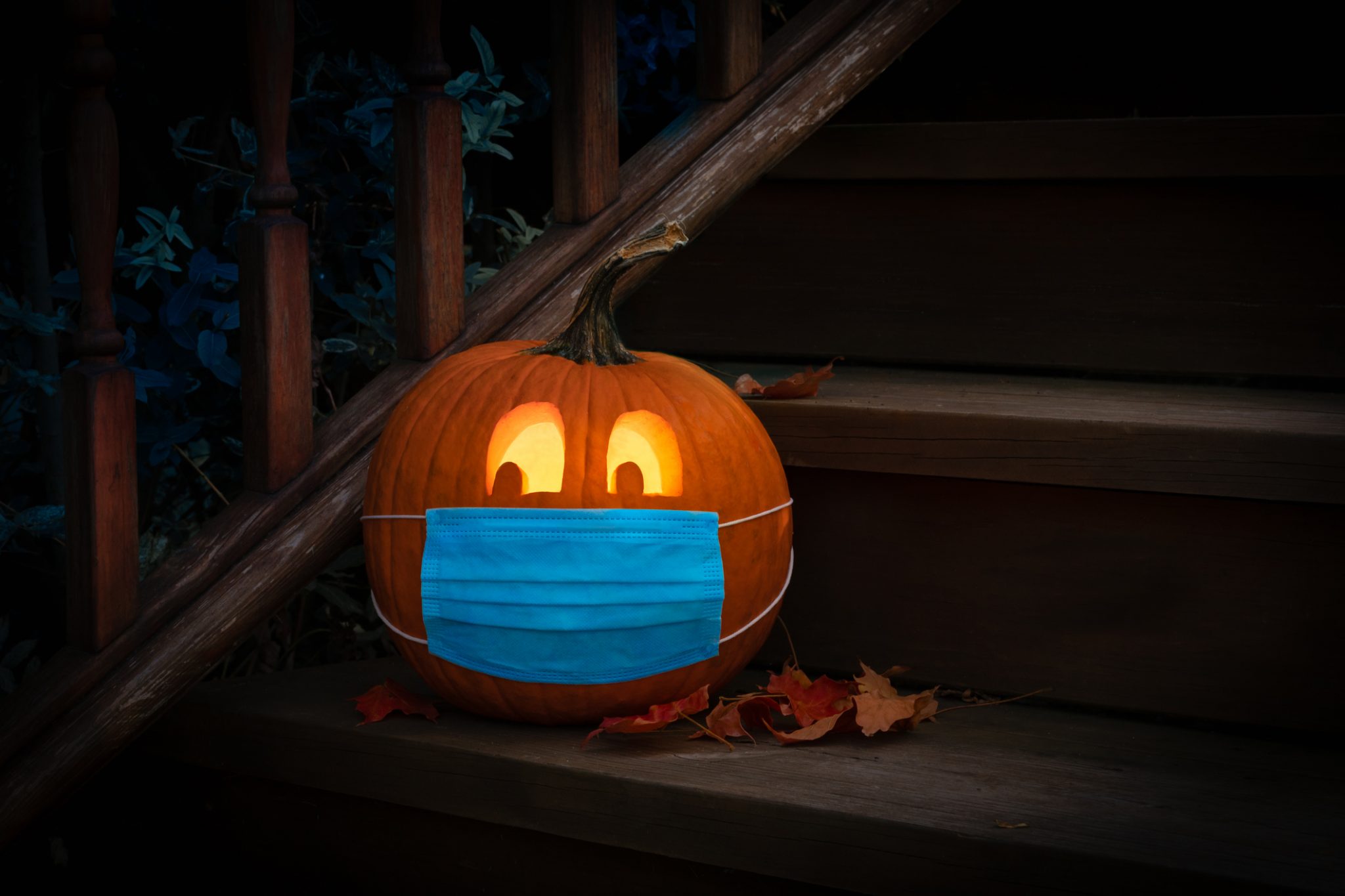 carved pumpkin with a mask on